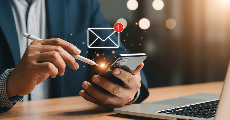 Person using smart phone with stylus and email graphic